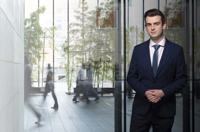 Business person walking in a urban building